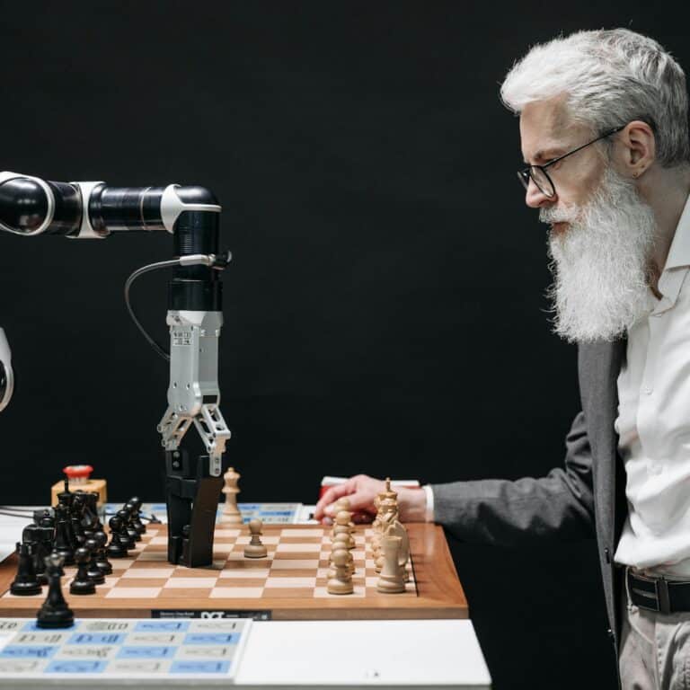 A man plays chess against an AI robotic arm, showcasing technology and strategy innovation.